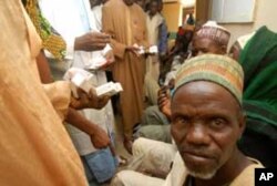 Dr. Achi, a pediatric ophthalmologist examining a child at National Eye Center , Kaduna