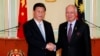 China's President Xi Jinping (L) and Malaysia's Prime Minister Najib Razak shake hands after their joint news conference at Najib's office in Putrajaya, near Kuala Lumpur Oct. 4, 2013.