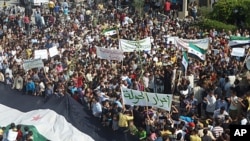 Demonstrators protest against Syria's President Bashar al-Assad in Hula, near Homs, October 27, 2011.