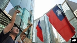 A group of anti-Japan protestors wave Taiwanese flags as they protest near the Japanese consulate in Hong Kong over the continued diplomatic dispute between Tokyo and Beijing over an archipelago, 17 Sep 2010