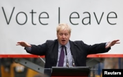 FILE - London Mayor Boris Johnson speaks at a "Out" campaign event, in favor of Britain leaving the European Union, at Europa Worldwide freight company in Dartford, Britain, March 11, 2016.