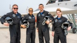 In this Aug. 8, 2021 photo provided by John Kraus, from left, Chris Sembroski, Sian Proctor, Jared Isaacman and Hayley Arceneaux stand for a photo in Bozeman, Mont., during a "fighter jet training" weekend. (John Kraus/Inspiration4 via AP)