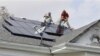 Installers for South Coast Solar install solar panels on the roof of a home n New Orleans, Wednesday, Nov. 12, 2008. Solar CEO Tucker Crawford credits the business boom in solar power to the tax breaks, whiche he called the "most aggressive tax credit (p