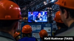 RUSSIA -- Workers of the ELSIB machine building company watch a live broadcast of Russian President Vladimir Putin's annual question and answer session in Novosibirsk, June 7, 2018