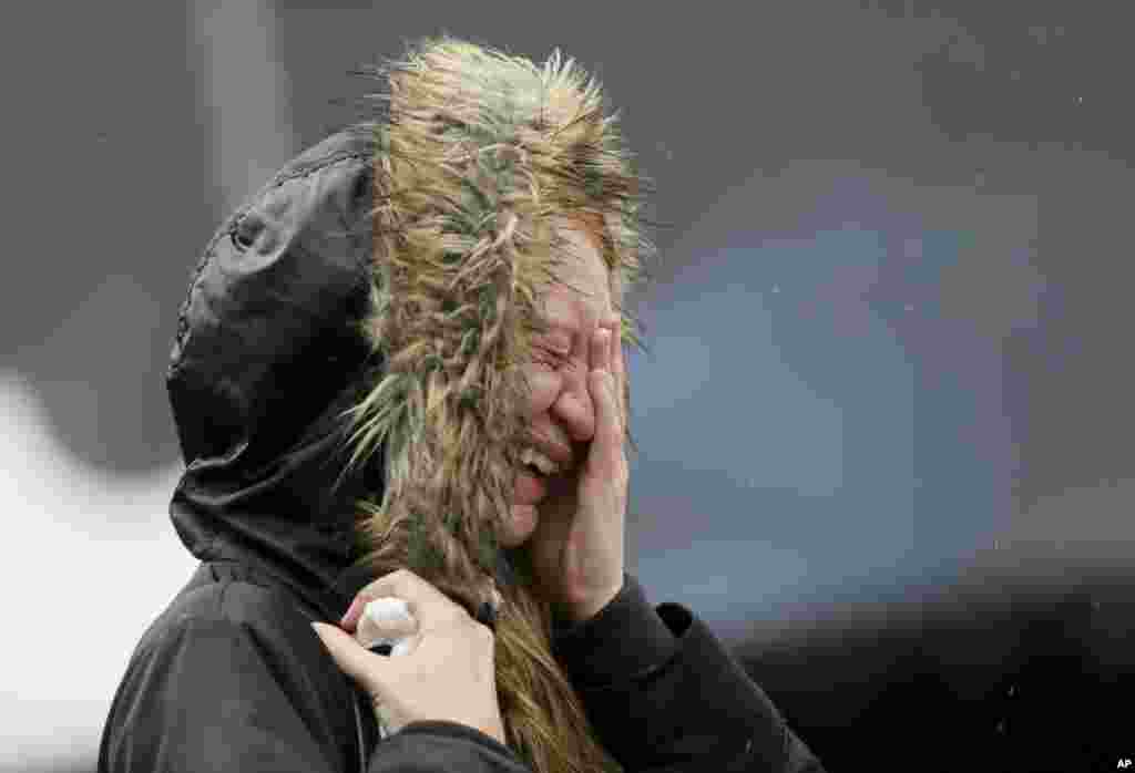 A woman cries at a memorial after a moment of silence to remember the victims of Saturday&#39;s attacks in the London Bridge area.