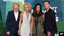 FILE - Phillip Sweet, from left, Kimberly Schlapman, Karen Fairchild and Jimi Westbrook, of Little Big Town, arrive at the CMT Music Awards at Bridgestone Arena in Nashville, Tennessee, June 10, 2015.