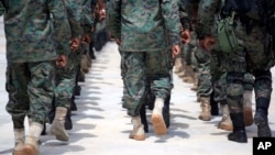 Members of Haiti's new national military force march during training at a former U.N. base in Gressier, Haiti, April 11, 2017. While it's easy to find citizens who strongly support reconstituting a Haitian army, the idea alarms those who vividly remember military coups and oppression. 