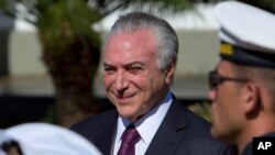 Brazil's President Michel Temer receives military honors during ceremony, in Brasilia, June 9, 2017. 