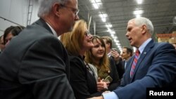 U.S. Vice President Mike Pence greets supporters following a speech about the American Health Care Act during a visit to the Harshaw-Trane Parts and Distribution Center in Louisville, Kentucky, March 11, 2017.