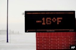 A Moorhead, Minnesota elementary school electronic sign shows to temperature, Jan. 29, 2019. Daytime temperatures in the Fargo ND-Moorhead MN area were near -20F as frigid weather grips the area.