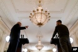 FILE - U.S. President Joe Biden speaks during a news conference with Ukrainian President Volodymyr Zelenskyy in Washington on Dec. 21, 2022. Zelenskyy has expressed disappointment that Biden will not be attending the Ukraine Peace Summit in Switzerland June 15-16, 2024.