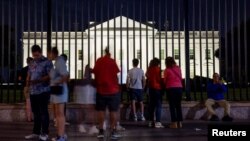 Tourists gather outside the White House as former U.S. President Donald Trump was addressing the Republican National Convention being held in Milwaukee, in Washington,