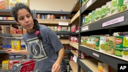 Stephanie Duboc of Eagle River, Alaska, shops at the Chugiak-Eagle River Food Pantry inside a Presbyterian church in Eagle River, Alaska on April 21, 2023. 