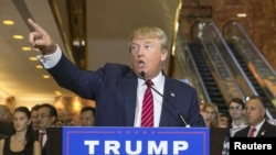 U.S. presidential hopeful Donald Trump speaks during a press availability after signing a pledge with the Republican National Committee (RNC) at Trump Tower in New York, Sept. 3, 2015.