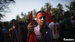 Garment workers rally minimum wage of 8,000 Bangladeshi Taka ($100) in Dhaka, Nov. 8, 2013.