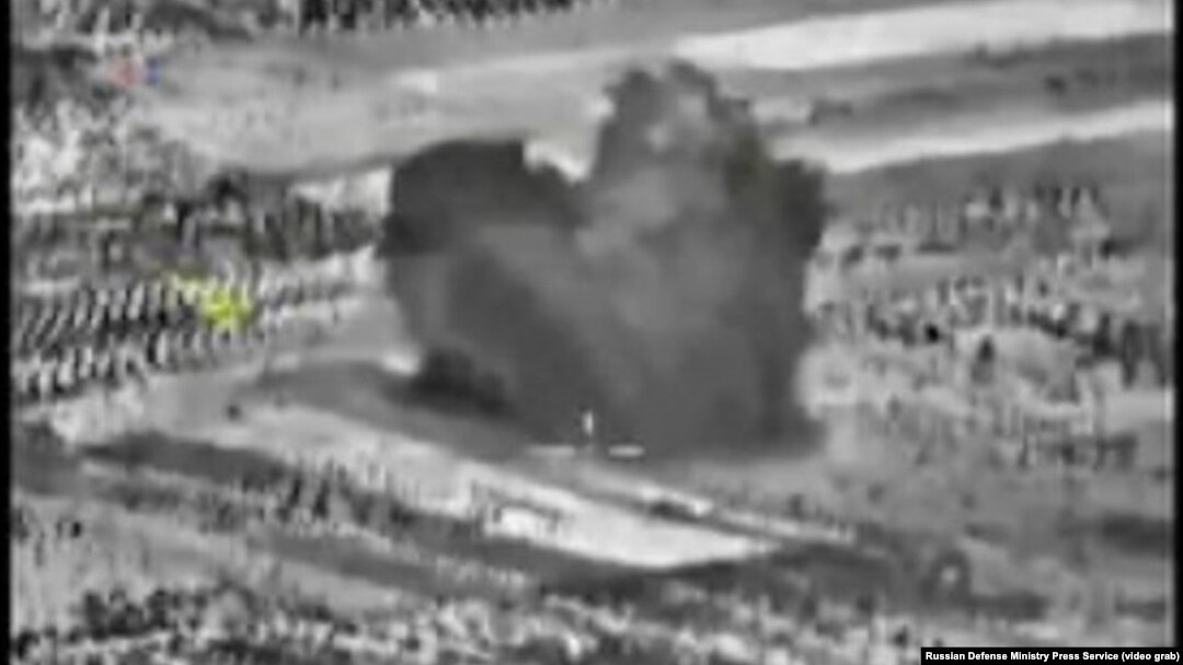An image taken from footage made available on the Russian Defense Ministry's official website purports to show an explosion after airstrikes carried out by the Russian air force, Oct. 3, 2015.