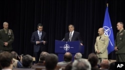 From left: U.S. General John Allen, nominated as Supreme Allied Commander Europe, NATO Secretary General Anders Fogh Rasmussen, United States Secretary of Defense Leon Panetta, current Supreme Allied Commander Europe U.S. Admiral James Stavridis, and U.S.