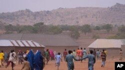 FILE — Children run in celebration after a false alarm that kidnapped LEA Primary and Secondary School students of Kuriga had been released in Kaduna state, Nigeria, Saturday, March 9, 2024.