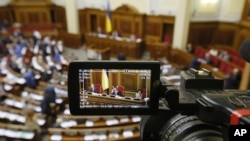 Ukraine's parliament rostrum is seen through a reporter's camera monitor in Kyiv, Sept. 17, 2015.