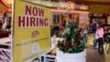 FILE - A restaurant posts a sign hoping to draw in job applicants, in Miami, Florida, Feb. 9, 2016. The Labor Department reported Friday that the U.S. economy had a net gain of 235,000 jobs for the month of February. 