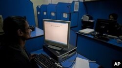 People use the Internet at a cafe in Pakistan where officials want to implement content filters, March 7, 2012.