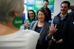 Democratic presidential candidate Sen. Amy Klobuchar, D-Minn., reacts while meeting supporters at a campaign office, Feb. 22, 2020, in Las Vegas.