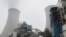 Water vapour rises from a cooling tower of a China Energy ultra-low emission coal-fired power plant during a media tour, Feb. 2, 2021.