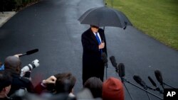 President Donald Trump speaks to members of the media before boarding Marine One on the South Lawn of the White House in Washington, Dec. 2, 2019. 
