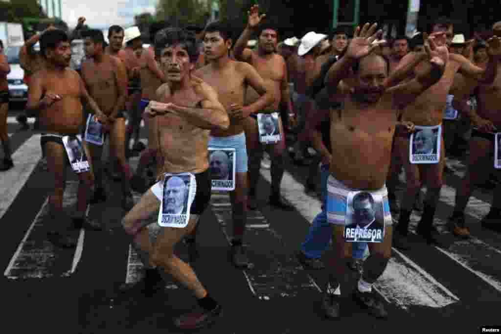 Peasants dance in their underwear during a demonstration to demand an audience with the Federal District authorities in Mexico City, Mexico, Sep. 12, 2013. The protesters belong to a group called the &quot;400 villages,&quot; who insist that land that they claim was unjustly taken away from them in Tabasco.