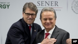 U.S Energy Secretary Rick Perry embraces Mexico's Secretary of Energy Pedro Joaquin Coldwell, after they made a joint statement in Mexico City, July 13, 2017. 