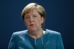 FILE - German Chancellor Angela Merkel speaks to media in Berlin, Germany, Sept. 2, 2020.