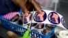 A poll worker prepares "I voted" stickers for voters at the City Clerk's Office ahead of the midterm election in Lansing, Michigan, U.S., Nov. 7, 2022.