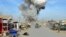 Smoke rises in the sky after a suicide car bomb attack in Kunduz province, February 10, 2015.