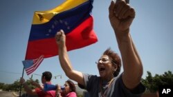 A woman chants anti-government slogans in a walkout against President Nicolas Maduro, in Maracaibo, Venezuela, Jan. 30, 2019. 