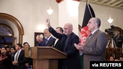 FILE - Afghan President Ashraf Ghani speaks after officials said he'd won a slim majority of votes in the nation's presidential election, in Kabul, Dec. 22, 2019. 