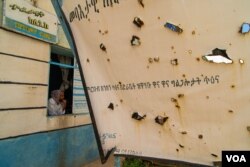 Nurse Tefetawit Tesfay waits for patients in her damaged and looted clinic in Edaga Hamus, a small town that has been the stage of battles during the ongoing conflict in the Tigray Region, in Ethiopia, on June 5, 2021. (Yan Boechat/VOA)