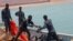 Somali Puntland forces receive weapons seized in a boat on the shores of the Gulf of Aden in the city of Bosasso, Puntland region, Somalia September 23, 2017.