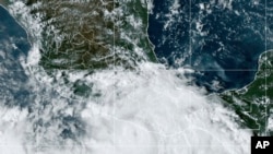 This National Oceanic and Atmospheric Administration satellite image taken at 6:10pm ET shows Hurricane John near southern Mexico on Sept. 23, 2024. (NOAA via AP)