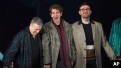 (L-R) Nathan Lane, Andrew Garfield and James McArdle participate in the curtain call for the "Angels in America" Broadway revival opening night at the Neil Simon Theatre, March 25, 2018, in New York.