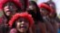 Brazilian Pataxo women take part in a ritual dance during a protest against a proposed constitutional amendment that would put demarcation of indigenous lands into the hands of the Congress, in front of Brazil’s National Congress, in Brasilia, Nov. 10, 2015.