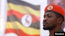 FILE - Ugandan opposition leader and singer Robert Kyagulanyi Ssentamu, known as Bobi Wine, addresses Ugandans living in South Africa at the sports ground in Germiston, southeast of Johannesburg, South Africa, Oct. 3, 2023. 