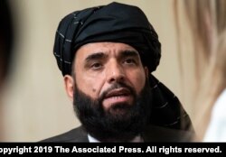 FILE - In this May 28, 2019 file photo, Suhail Shaheen, spokesman for the Taliban's political office in Doha, speaks to the media in Moscow, Russia.
