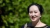 FILE - Huawei Technologies Chief Financial Officer Meng Wanzhou leaves her home to attend a court hearing in Vancouver, British Columbia, in June 2020.