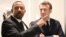 Ethiopian Prime Minister Abiy Ahmed (L) speaks with French President Emmanuel Macron (R) before a meeting in Addis Ababa, March 12, 2019.