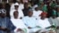 FILE - Muhammadu Buhari, former military ruler and presidential aspirant (C), and other party leaders attends the All Progressive Congress party convention in Lagos, Nigeria.