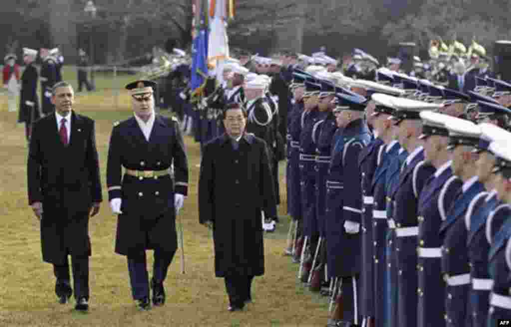 President Barack Obama and China's President Hu Jintao inspect the troops during a state arrival ceremony at the White House in Washington, Wednesday, Jan. 19, 2011. (AP Photo/J. Scott Applewhite)