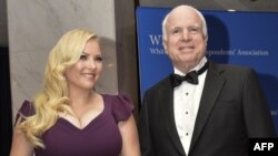 FILE - U.S. Sen. John McCain and his daughter, Meghan McCain, arrive at the White House Correspondents' Association annual dinner in Washington, May 3, 2014.