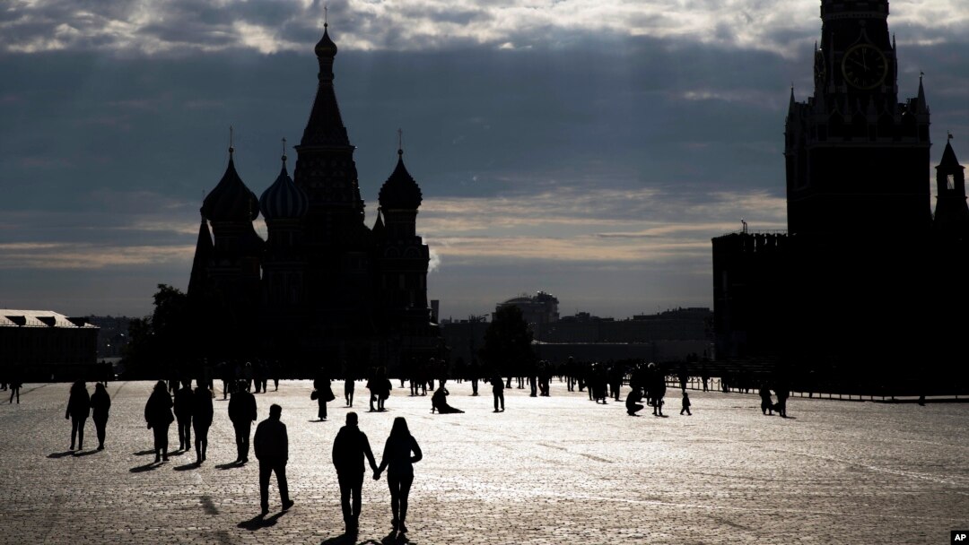 FILE - People walk through Red Square in Moscow.