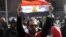 Man holds Egyptian flag with Arabic words “Tiran is Egyptian” in front of the Egyptian Administrative Court in Giza, Egypt, Jan 16, 2017. (Photo: Hamada Elrasam for VOA)