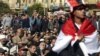 Demonstrators take part in a protest demanding the army hand over power to civilians in Tahrir Square, Cairo. January 27, 2012. 